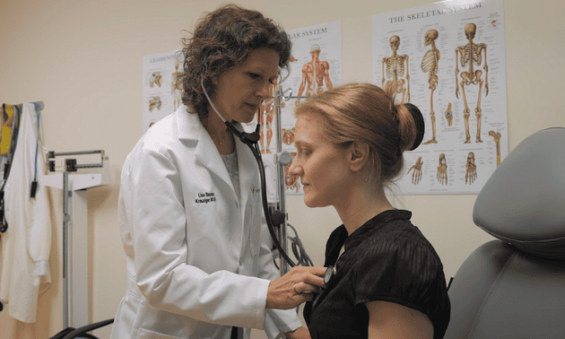 Lisa Baumann Kreuziger, MD, MS, with a patient in Versiti's Comprehensive Center for Bleeding Disorders