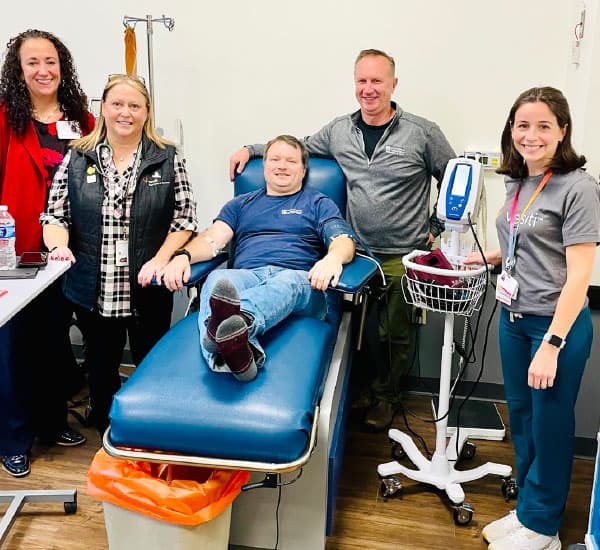 Cody Gunst, pictured alongside his Versiti medical team, was one of the first patients in the United States to receive HEMGENIX, a groundbreaking gene therapy for severe hemophilia B.