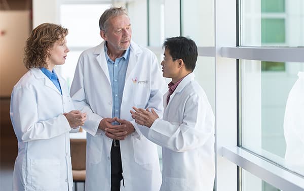 Researchers Collaborating on Research Findings