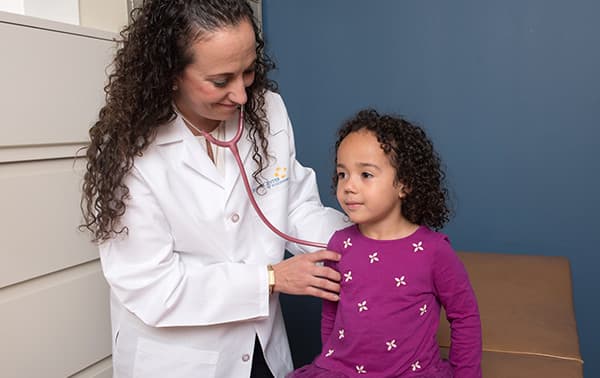 Dr. Malec working with a patient.