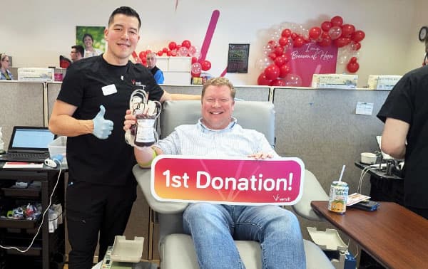 Manitowoc mayor, Justin Nickels making his first blood donation.