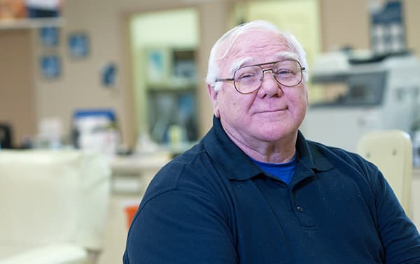 Benjamin, a smiling blood donr before his appointment