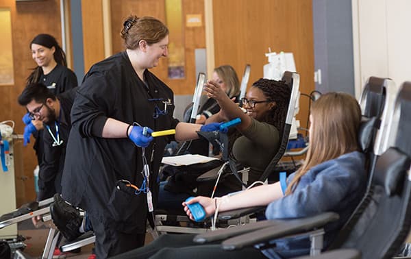 A group of donors during a mobile blood drive.
