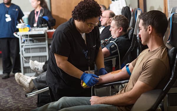 James, giving blood at a mobile blood drive.