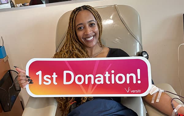 Smiling woman making her first donation.
