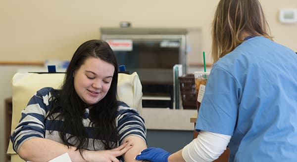 Young woman making a blood donation