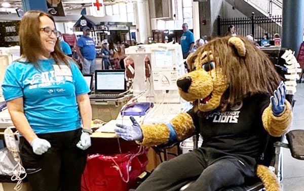 Phlebotomist assists a donor during the One Pride Blood Drive.