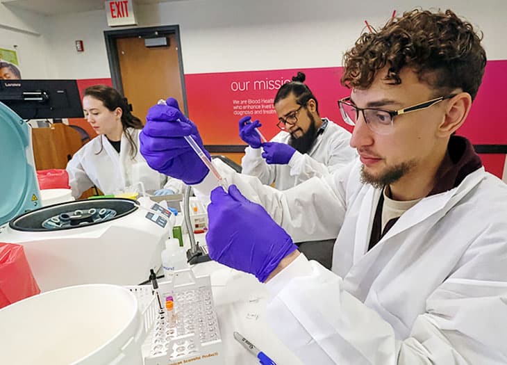 SBB Students learning about blood typing and testing.