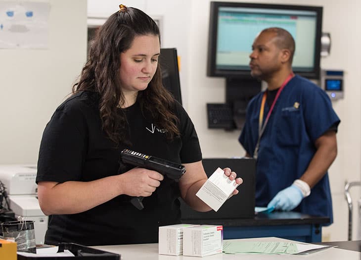 Amber in Wholesale Drug Distribution filling a customer order.